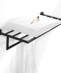 Chrome Wall Mounted Towel Rack For Bathroom Modern Hotel Style Towel Bar Shelf Single Towel Holder 26 Inch Durable Brass Construction Leo Series Collection displaying white towels and a perfume bottle on its shelf