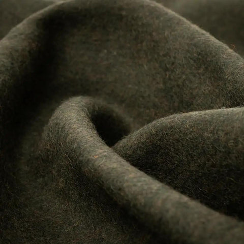 Close-up of olive green military wool texture, showcasing the Beefy Warmth And Rugged Durability Military Wool Blanket.