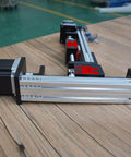 Kickass Xy Linear Motion Stage Featuring 500Mm X And 300Mm Y Stroke Ball Screw Guide Table powered by Nema 23 motors on wooden surface.