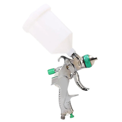 Professional Grade Hvlp Paint Sprayer Kit With Six Hundred Mil Gravity Tank And Three Nozzle Heads For Slick Auto Basecoat And Clearcoat Work With Zero Headaches And Crisp Coverage, featuring a silver spray gun with a 600ml gravity cup.