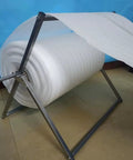Premium Foldable Bubble Wrap Holder And Transport Station Dispenser Built Dang Tough With Rust Resistant Galvanized Steel displaying rolled bubble wrap.