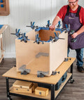 Clamp It Corner Woodworking Jig For 90 Degree Right Angle Cabinet Assembly in use on wooden cabinet, hands-free positioning.