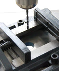 3 Inch Drill Press Vise For Precision Drilling Milling And Woodworking Cast Iron Construction Heavy Duty Clamp With Stable Jaws And Low Vibration So Your Projects Stay Rock Solid, shown holding workpiece under drill bit