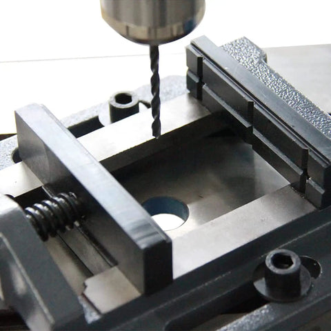 3 Inch Drill Press Vise For Precision Drilling Milling And Woodworking Cast Iron Construction Heavy Duty Clamp With Stable Jaws And Low Vibration So Your Projects Stay Rock Solid, shown holding workpiece under drill bit
