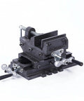 3 Inch Bench Vise With Cross Slide For Machine And Drill Press Heavy Duty Cast Iron Frame with dual hand cranks and steel stand.