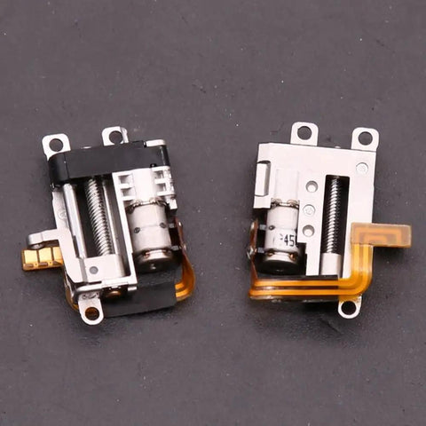 Two compact mini stepper motors with metal casings and internal gears for Badass Compact Linear Actuator Packing Smooth Planetary Gearbox.