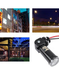 Automatic Dusk To Dawn Photoelectric Switch with outdoor light sensor next to images of illuminated city street and patio, for 120V fixtures.