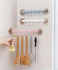Self Adhesive Bathroom Towel Ring Holder With Rock Solid Grip Pad For Hassle Free Wall Mount Kitchen Storage Rack Stainless Steel Look featuring colorful hooks holding kitchen utensils.