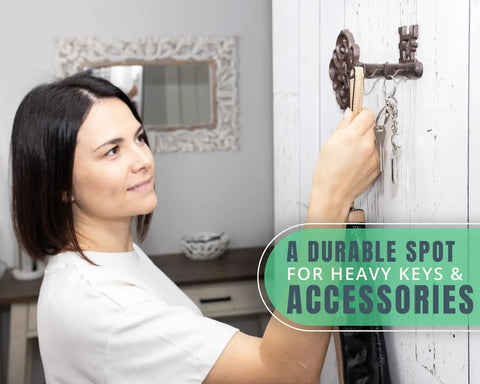 Woman hanging keys on Brown Cast Iron Skeleton Key Wall Hook With Three Heavy Duty Coat Holders For Classic Farmhouse Vibes.