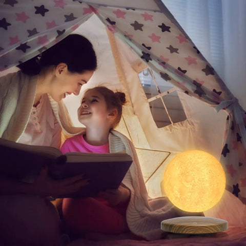 Floating Moon Lamp With Magnetic Levitation Base, 18 Color Spinning 3D Night Light beside mother and daughter in tent
