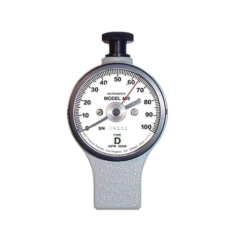 Heavy Duty Dial Hardness Tester For Gauging Metal And Plastic Toughness Sporting A Crisp Analog Face and gray textured chassis.