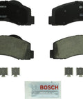 Bosch BC1414 front view ceramic brake pad set with backing plates, clips, and lubricant pouch