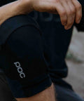 Close-up of Oseus VPD Knee Pads for mountain biking and enduro, certified MTB knee protection, worn by cyclist on trail.