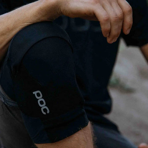 Close-up of Oseus VPD Knee Pads for mountain biking and enduro, certified MTB knee protection, worn by cyclist on trail.