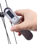 Hand holding Archery Bow Scale for Recurve and Compound Bows 110 Pounds 50 Kilograms LCD Display showing weight in pounds.