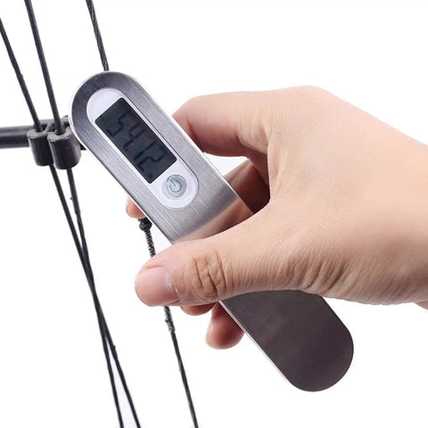 Hand holding Archery Bow Scale for Recurve and Compound Bows 110 Pounds 50 Kilograms LCD Display showing weight in pounds.