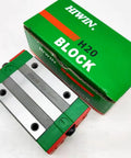Beefy HGH20CA Linear Block Carriage With 20mm Square Linear Guide Rails next to green Hiwin H20 block packaging