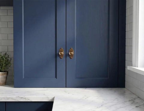 Top Notch Heavy Duty Solid Zinc Cabinet Knobs With Vintage Oval Beaded Back Plates Antique Brass Finish six pack on navy cabinet doors.