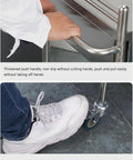Person using handle and foot brake on Beefy Stainless Steel Medical Cart On Wheels With 2 Tier Drawer, 100 Kg Max Load.