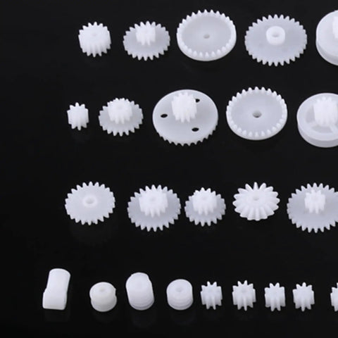Durable Plastic Gear Kit Set For DIY Robots Cars And Tech Projects Includes 64 Wearable Crown Pulley Belt Gears Built Tough For Long Service Life Perfect For Creative Model Building And Mechanic Hobbyist Gadgets white plastic gears on black background
