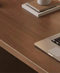 Solid Walnut Electric Standing Desk With Built In Charging Ports For Legit Smooth Height Adjustments And Pro Home Office Setup Ergonomic Sit Stand Workstation To Slash Back Pain And Boost Daily Grind showing smooth walnut surface with laptop.
