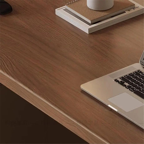 Solid Walnut Electric Standing Desk With Built In Charging Ports For Legit Smooth Height Adjustments And Pro Home Office Setup Ergonomic Sit Stand Workstation To Slash Back Pain And Boost Daily Grind showing smooth walnut surface with laptop.