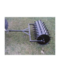 36 Inch Wide Lawn Aerator Roller With 78 Steel Spikes And 24 Gallon Water Holder For Behind Mower Or ATV Use on grass