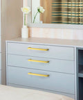 Room with dresser showcasing 30 Pack Seven And A Half Inch Square Cabinet Handles Brushed Brass Drawer Pulls on drawers