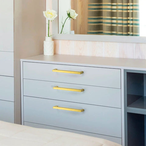 Room with dresser showcasing 30 Pack Seven And A Half Inch Square Cabinet Handles Brushed Brass Drawer Pulls on drawers