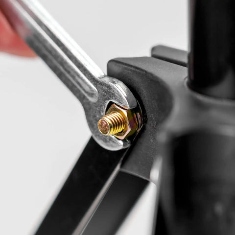 Close-up of a spanner tightening a 10 Pack M8-1.25 Carbon Steel Fully Threaded Rods, 65mm Length, Zinc Plated fastener in assembly