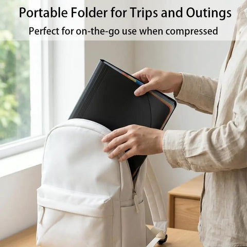 Person placing 13 Pocket Expanding Accordion File Organizer with 6 Section Dividers into white backpack, ideal for travel.
