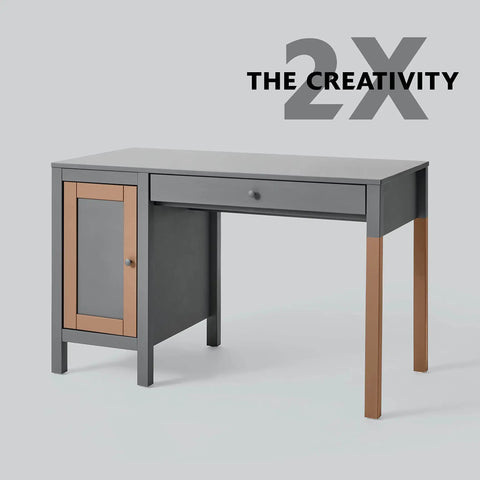 Gray and brown modern desk with drawer and cabinet, labeled "2X The Creativity" against a neutral background.