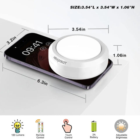 Under Cabinet Puck Lights Remote Battery Operated Wireless Stick On 4 Pack, white puck light on smartphone showing size.