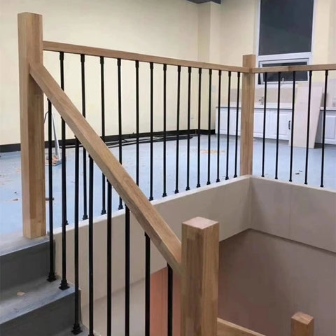 Top Tier Adjustable Black Wrought Iron Stair Railing For Indoor And Outdoor Deck Projects, with wooden handrail and balusters.