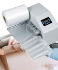 Dang Fast Portable Air Pillow Maker in use, creating protective air pillows for shipping with clear plastic film.