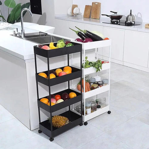 Two kitchen trolleys with fruits and vegetables beside a modern kitchen island.