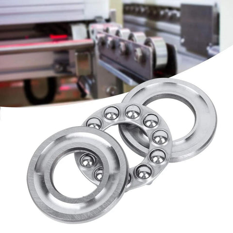 Five silver axial ball thrust bearings with 5/8-inch bore and outer races