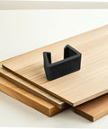 Six Pack Outdoor Sofa Clips For Rattan Wicker Sectional Couches, Black Plastic Fasteners With 6cm Slot on stacked wooden panels