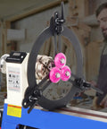 Three Point Woodturning Adjustable Steady Rest For A 12 Inch Lathe Swing with non marring wheels on a midi lathe in workshop