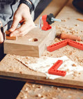 Person using Sixteen Piece Right Angle Clamp Set For Woodworking with 90 Degree Positioning Squares on wood board
