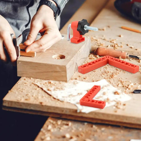 Person using Sixteen Piece Right Angle Clamp Set For Woodworking with 90 Degree Positioning Squares on wood board