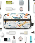 Airplane Cosmetic Bag For Women Travel Makeup Organizer Pouch Kit Waterproof Durable Polyester Toiletries Case With Carry On Size 10.5 By 4.4 By 5.3 Inches For Easy On The Go surrounded by toiletries and makeup accessories.