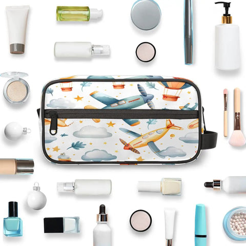 Airplane Cosmetic Bag For Women Travel Makeup Organizer Pouch Kit Waterproof Durable Polyester Toiletries Case With Carry On Size 10.5 By 4.4 By 5.3 Inches For Easy On The Go surrounded by toiletries and makeup accessories.