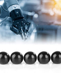 Five Pack Black Round Ball Knobs With M8 Female Thread 32mm Diameter Bakelite Lever Knobs in front of robotic machinery.