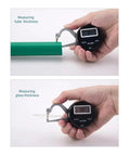 Digital Electronic Thickness GAGE 0-1"/25mm measuring tube and glass thickness in hands with digital display.