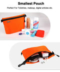 Smallest pouch from the Three Pack Travel Toiletry Bags for Men Carry-On Organizer set, with toiletries and electronics.