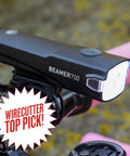 Beamer 700 Bike Headlight USB C Rechargeable With Five Modes mounted on a bike handlebar with Wirecutter Top Pick badge visible