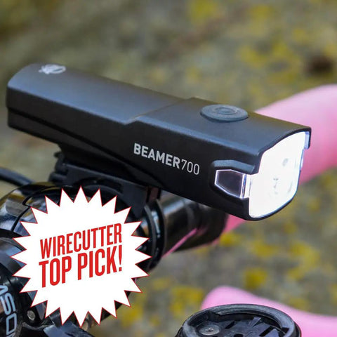 Beamer 700 Bike Headlight USB C Rechargeable With Five Modes mounted on a bike handlebar with Wirecutter Top Pick badge visible