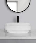 USZWBY Vessel Sinks Simple Square Rounded Corner Bathroom Ceramic Vessel Sink Large Size on marble countertop with a black faucet.