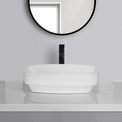 USZWBY Vessel Sinks Simple Square Rounded Corner Bathroom Ceramic Vessel Sink Large Size on marble countertop with a black faucet.
